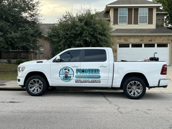 Pioneer Window Cleaning truck parked outside a customer's home